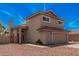 Two-story home featuring a terra cotta roof, two-car garage, and desert landscaping at 15440 S 38Th St, Phoenix, AZ 85044