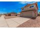 Two-story home with a terra cotta roof, two-car garage, and desert landscaping at 15440 S 38Th St, Phoenix, AZ 85044