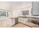 Bright kitchen featuring granite counters, stainless steel appliances, and white cabinetry at 15440 S 38Th St, Phoenix, AZ 85044