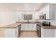 Bright kitchen featuring granite counters, stainless steel appliances, and white cabinetry at 15440 S 38Th St, Phoenix, AZ 85044