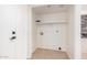 This laundry room features a wire shelf and tile floors at 15440 S 38Th St, Phoenix, AZ 85044