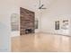 Living room with wood fireplace, tall ceilings, tile flooring and French doors at 15440 S 38Th St, Phoenix, AZ 85044