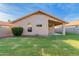 Backyard view with freshly laid sod and view of the home's rear exterior at 1627 W Maplewood St, Chandler, AZ 85286