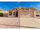 Single Gathering home with large window and two-car garage, landscaping with desert rock and a terracotta roof at 1627 W Maplewood St, Chandler, AZ 85286