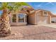 Single Gathering home with large window and two-car garage, landscaping with desert rock and a terracotta roof at 1627 W Maplewood St, Chandler, AZ 85286