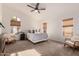 Bright main bedroom featuring a ceiling fan, carpet flooring, and a private window at 1627 W Maplewood St, Chandler, AZ 85286