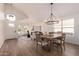 Bright open floorplan featuring the living room, dining room, and front entry at 1627 W Maplewood St, Chandler, AZ 85286
