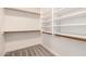 Empty walk-in closet with carpet flooring and built-in shelving at 1627 W Maplewood St, Chandler, AZ 85286