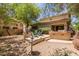 This backyard features a built-in grill, a fire pit, and lots of room to entertain at 1925 W Olive Way, Chandler, AZ 85248