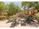 This outdoor firepit with adirondack chairs is the perfect place to relax outdoors at 1925 W Olive Way, Chandler, AZ 85248
