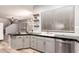 Modern kitchen features stainless steel appliances, floating shelves, and stylish backsplash at 1925 W Olive Way, Chandler, AZ 85248
