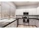 Bright kitchen featuring stainless appliances, white cabinets, and granite countertops at 1925 W Olive Way, Chandler, AZ 85248