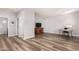 The living room features wood-look floors and a TV on top of wooden drawers at 1925 W Olive Way, Chandler, AZ 85248
