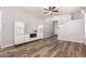 Bright living area showcasing sleek built-ins, wood floors, and an open layout to the staircase at 1925 W Olive Way, Chandler, AZ 85248