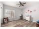 Cozy living room showcasing hardwood flooring, natural lighting and tasteful decor at 1925 W Olive Way, Chandler, AZ 85248