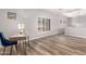 This living room features wood-look floors and a desk with a blue velvet chair at 1925 W Olive Way, Chandler, AZ 85248