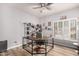 Home office features a corner desk, built-in shelving, and natural lighting at 1925 W Olive Way, Chandler, AZ 85248
