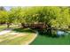 Picturesque pond featuring a charming bridge surrounded by lush greenery, creating a serene natural setting at 1925 W Olive Way, Chandler, AZ 85248