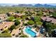 Scenic aerial view of a community featuring a resort-style pool, well-manicured landscaping, and stunning mountain views at 20750 N 87 St # 2103, Scottsdale, AZ 85255