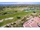 Expansive aerial view of the golf course and neighborhood with mountain views beyond at 20750 N 87 St # 2103, Scottsdale, AZ 85255