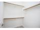 Walk-in closet equipped with shelves, and a light for optimal visibility at 20750 N 87 St # 2103, Scottsdale, AZ 85255