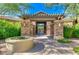 Welcoming community entrance with stone pillars, pergola, and manicured landscaping at 20750 N 87 St # 2103, Scottsdale, AZ 85255