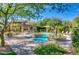 Resort-style community pool with seating, lush landscaping, and various lounge seating, perfect for relaxation at 20750 N 87 St # 2103, Scottsdale, AZ 85255
