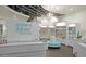 Bright salon interior featuring a reception desk, seating area, product display shelves, and elegant lighting fixtures at 20750 N 87 St # 2103, Scottsdale, AZ 85255