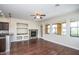 Bright living space featuring hardwood floors, large windows, and an open layout to the kitchen at 20750 N 87 St # 2103, Scottsdale, AZ 85255