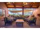 Inviting outdoor seating area with comfortable couches, chairs, and overhead string lights at 20750 N 87 St # 2103, Scottsdale, AZ 85255