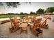 Charming outdoor seating area with fire pit and Adirondack chairs, perfect for relaxing at 20750 N 87 St # 2103, Scottsdale, AZ 85255