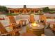 Inviting outdoor space with Adirondack chairs around a cozy fire pit, and lush landscaping at 20750 N 87 St # 2103, Scottsdale, AZ 85255