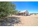 Spacious backyard with patio, grill, and picnic table, perfect for outdoor entertaining and relaxing at 22222 W Lower Buckeye Rd, Buckeye, AZ 85326