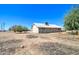 Expansive backyard with a single-story house, offering a blank canvas for outdoor living and landscaping possibilities at 22222 W Lower Buckeye Rd, Buckeye, AZ 85326