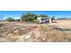 Wide backyard with an old trailer and some trees at 22222 W Lower Buckeye Rd, Buckeye, AZ 85326