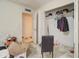 This is a bedroom with an open closet and a view into another room at 22222 W Lower Buckeye Rd, Buckeye, AZ 85326