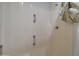 This image shows a bathtub with accessibility grab bars and a shower curtain at 22222 W Lower Buckeye Rd, Buckeye, AZ 85326