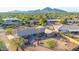 This aerial shot features a well-maintained single-story home, desert landscaping, and a cozy patio setting at 2319 N 58Th St, Scottsdale, AZ 85257