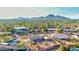 Scenic aerial view showcasing the desert home with mountain views and lush desert landscaping at 2319 N 58Th St, Scottsdale, AZ 85257