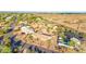 A detailed aerial view showcases the house within its neighborhood, emphasizing its well-kept desert landscaping at 2319 N 58Th St, Scottsdale, AZ 85257