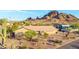 Desert landscape and tall cacti surround the house in an aerial shot of the home and community at 2319 N 58Th St, Scottsdale, AZ 85257