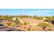 An aerial view of a single Gathering home with desert landscaping and many tall cacti at 2319 N 58Th St, Scottsdale, AZ 85257