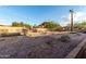 Expansive backyard with desert landscaping and perimeter brick trim at 2319 N 58Th St, Scottsdale, AZ 85257