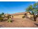 Lovely single-story home featuring a well-manicured yard and clear blue sky at 2319 N 58Th St, Scottsdale, AZ 85257