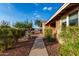 Charming single-story home with a desert landscape and well-manicured bushes at 2319 N 58Th St, Scottsdale, AZ 85257