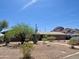 Charming home featuring desert landscaping, mature trees, and mountain views at 2319 N 58Th St, Scottsdale, AZ 85257