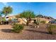 Classic single-story home with desert landscaping and mature foliage at 2319 N 58Th St, Scottsdale, AZ 85257