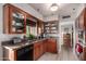 Charming kitchen with wood cabinets, granite counters, and stainless-steel appliances at 2319 N 58Th St, Scottsdale, AZ 85257