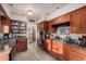 Spacious kitchen featuring wood cabinets, granite counters, and modern appliances at 2319 N 58Th St, Scottsdale, AZ 85257