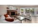 Cozy living room showcases a brick fireplace and comfortable seating with outside views at 2319 N 58Th St, Scottsdale, AZ 85257